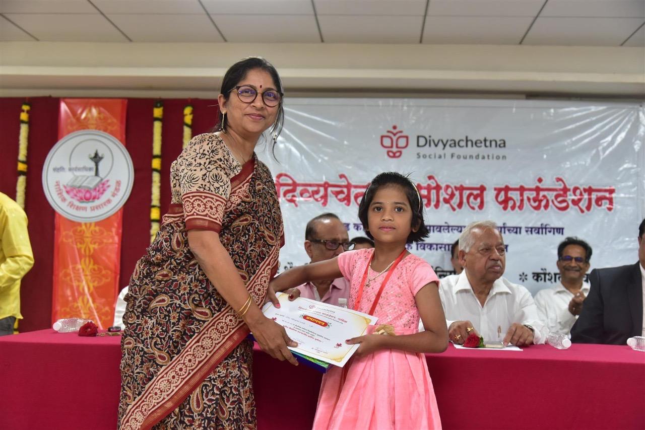 A Divyachetna volunteer with a supported student